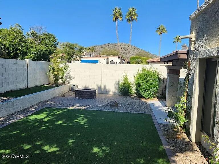 4615 East Monte Way Phoenix, AZ 85044 - Photo 4 of 18 a view of a backyard