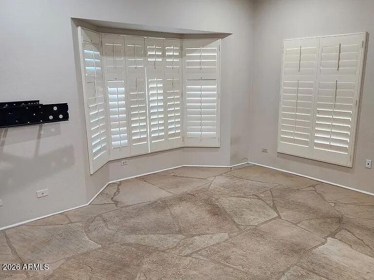 4615 East Monte Way Phoenix, AZ 85044 - Photo 9 of 18 a view of an empty room with a window