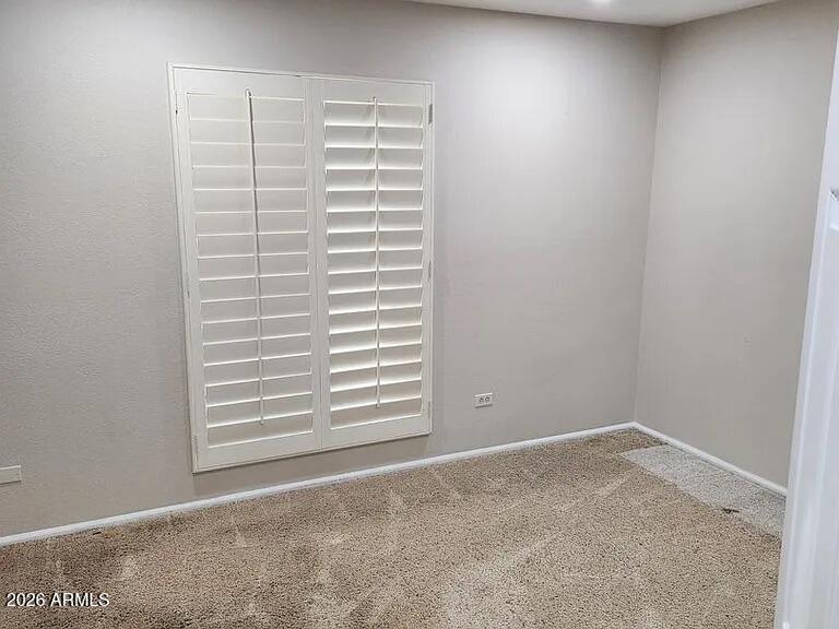 4615 East Monte Way Phoenix, AZ 85044 - Photo 10 of 18 a view of wooden floor and white cabinet