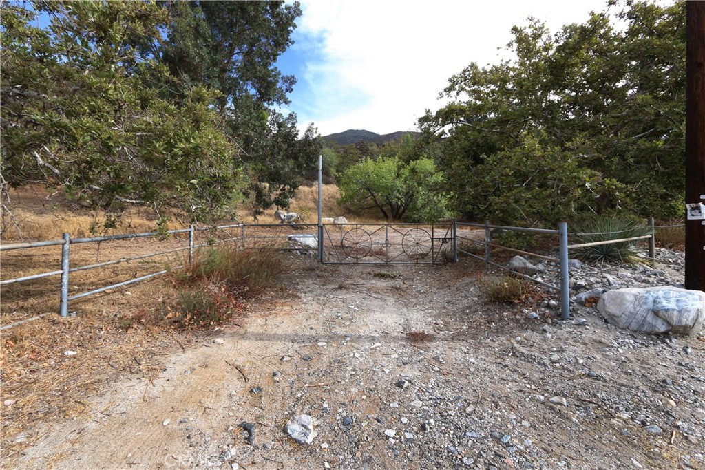 0 Na San Bernardino, CA 92407 - Photo 9 of 10 a view of backyard with wooden fence and large trees