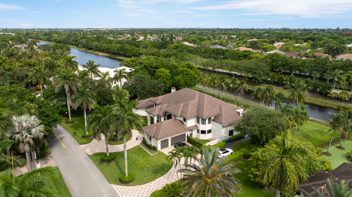 3500 Windmill Ranch Road Weston, FL 33331 - Photo 38 of 47 an aerial view of a house with a garden and lake view