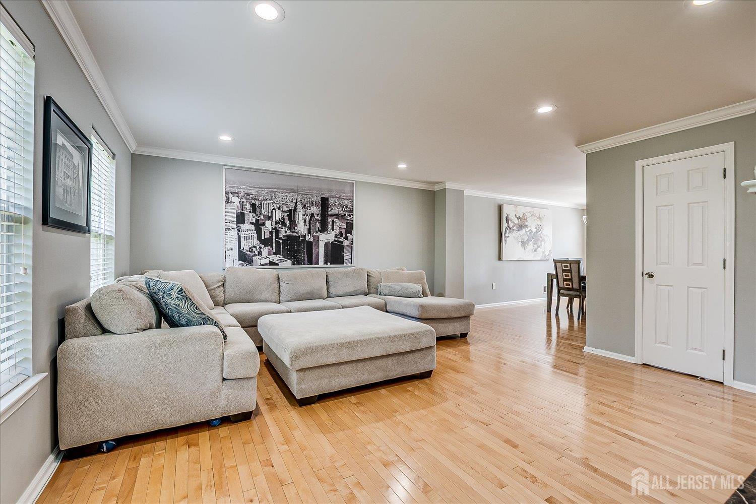 39 Rojewski Way Sayreville, NJ 08859 - Photo 11 of 40 a living room with furniture and a wooden floor