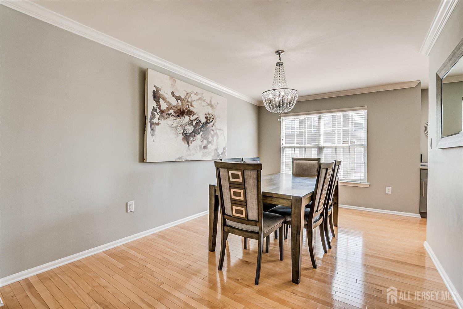 39 Rojewski Way Sayreville, NJ 08859 - Photo 12 of 40 a view of a dining room with furniture window and wooden floor