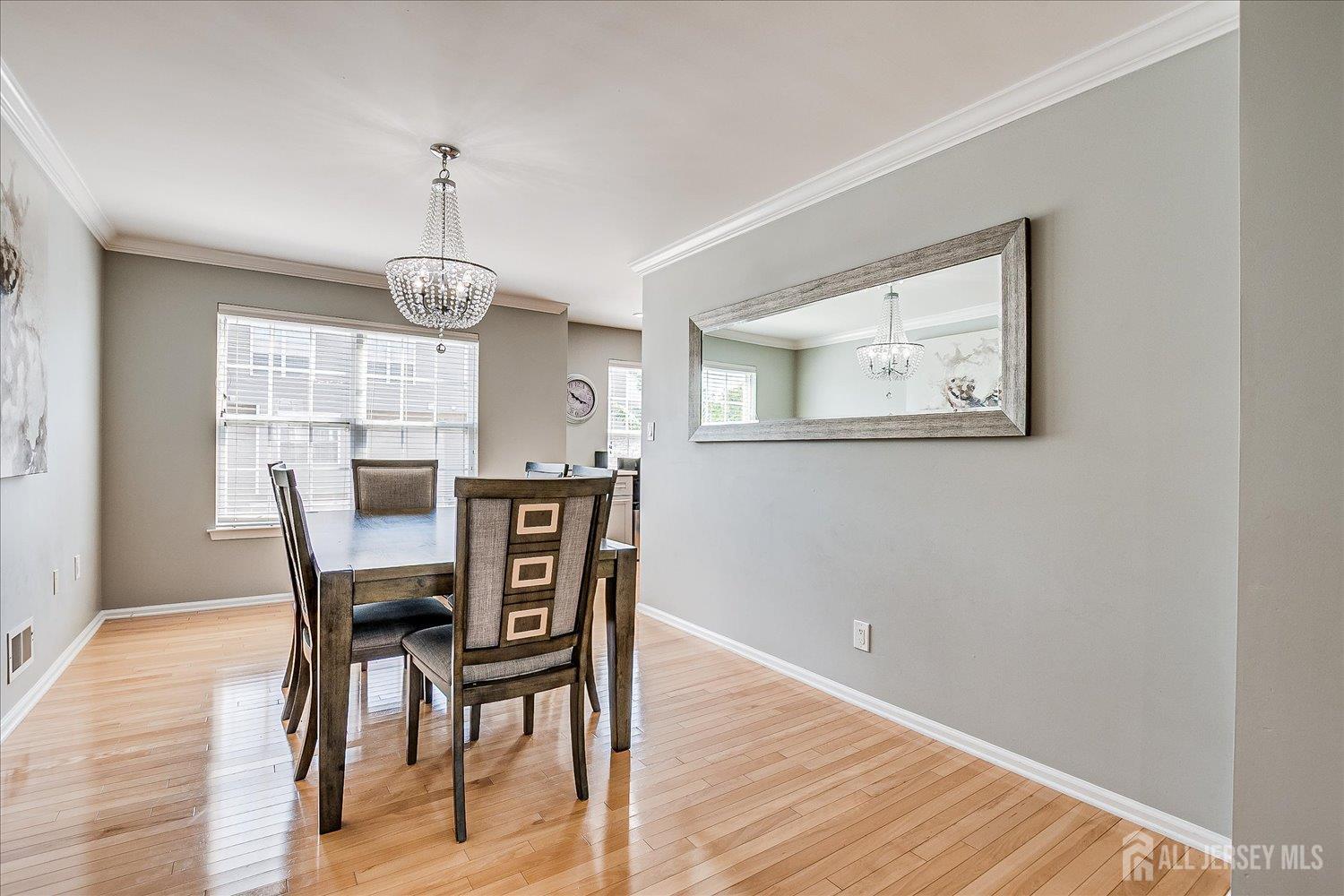 39 Rojewski Way Sayreville, NJ 08859 - Photo 13 of 40 a view of a dining room with furniture window and wooden floor