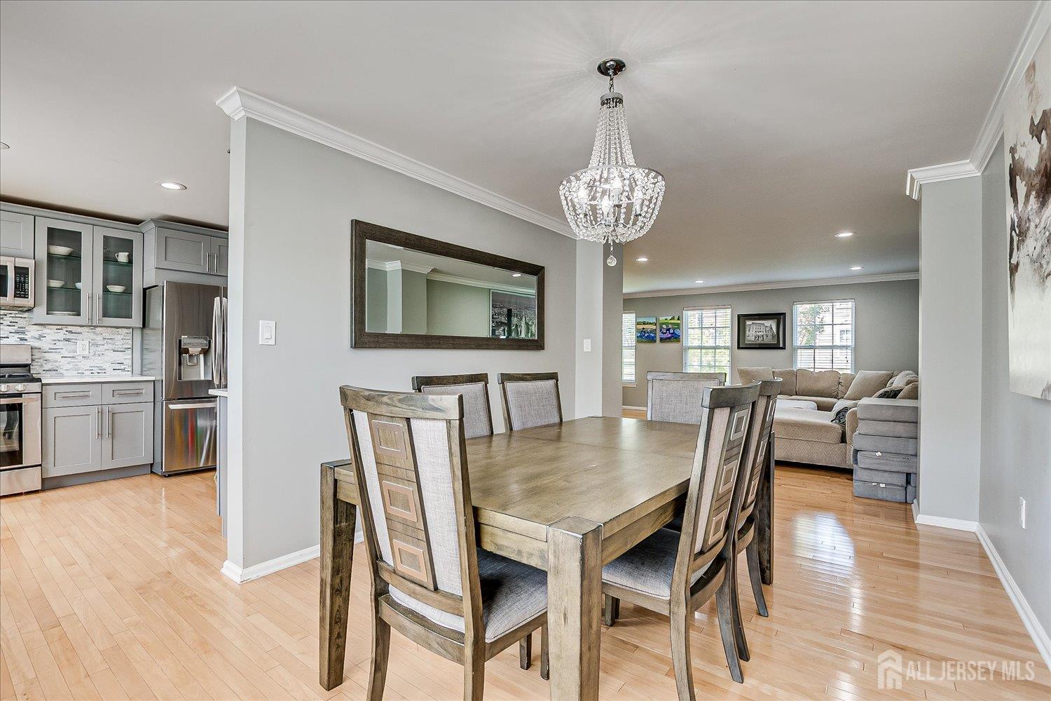 39 Rojewski Way Sayreville, NJ 08859 - Photo 14 of 40 a view of a dining room with furniture and wooden floor