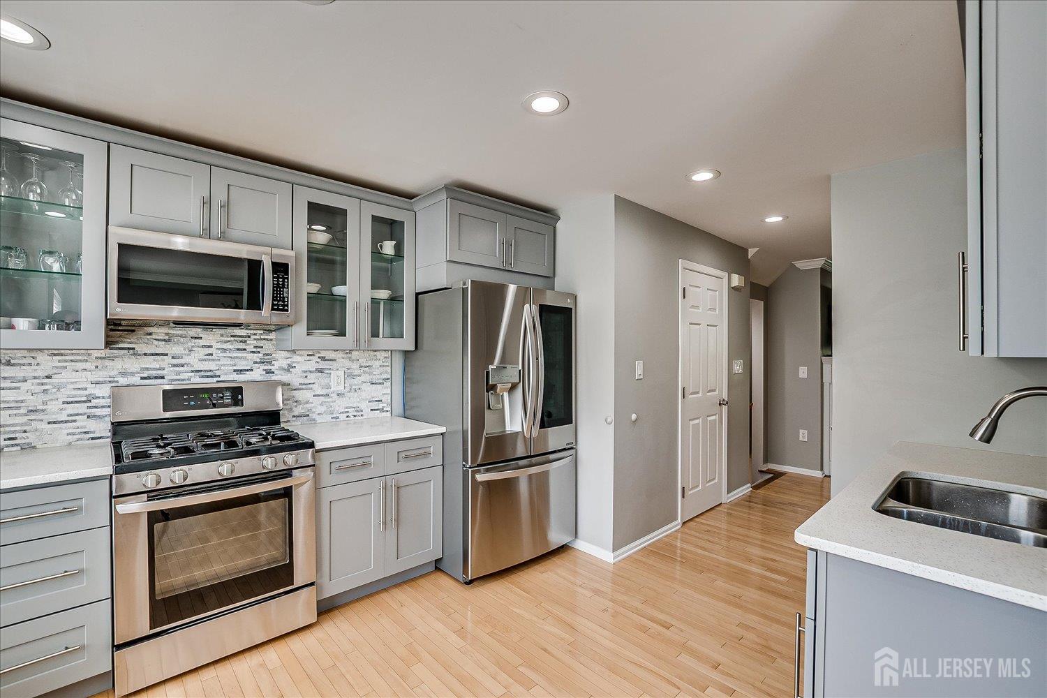 39 Rojewski Way Sayreville, NJ 08859 - Photo 19 of 40 a kitchen with a refrigerator stove and microwave