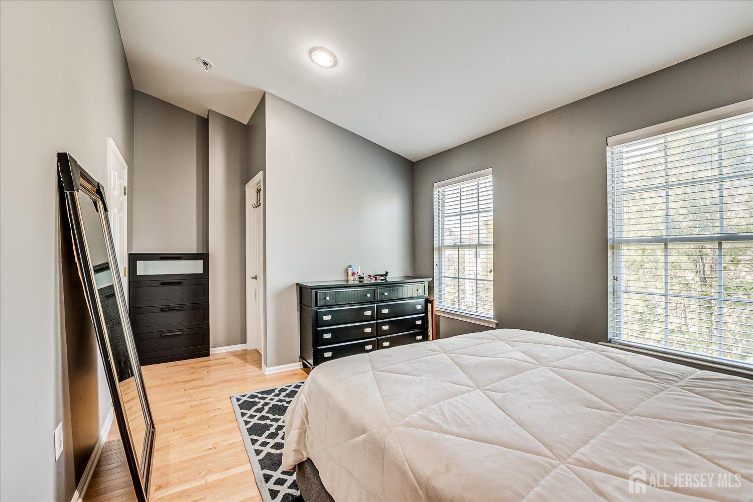 39 Rojewski Way Sayreville, NJ 08859 - Photo 23 of 40 a bedroom with a bed and wooden floor
