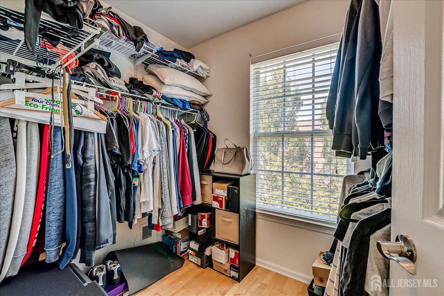 39 Rojewski Way Sayreville, NJ 08859 - Photo 24 of 40 a view of walk in closet with clothes
