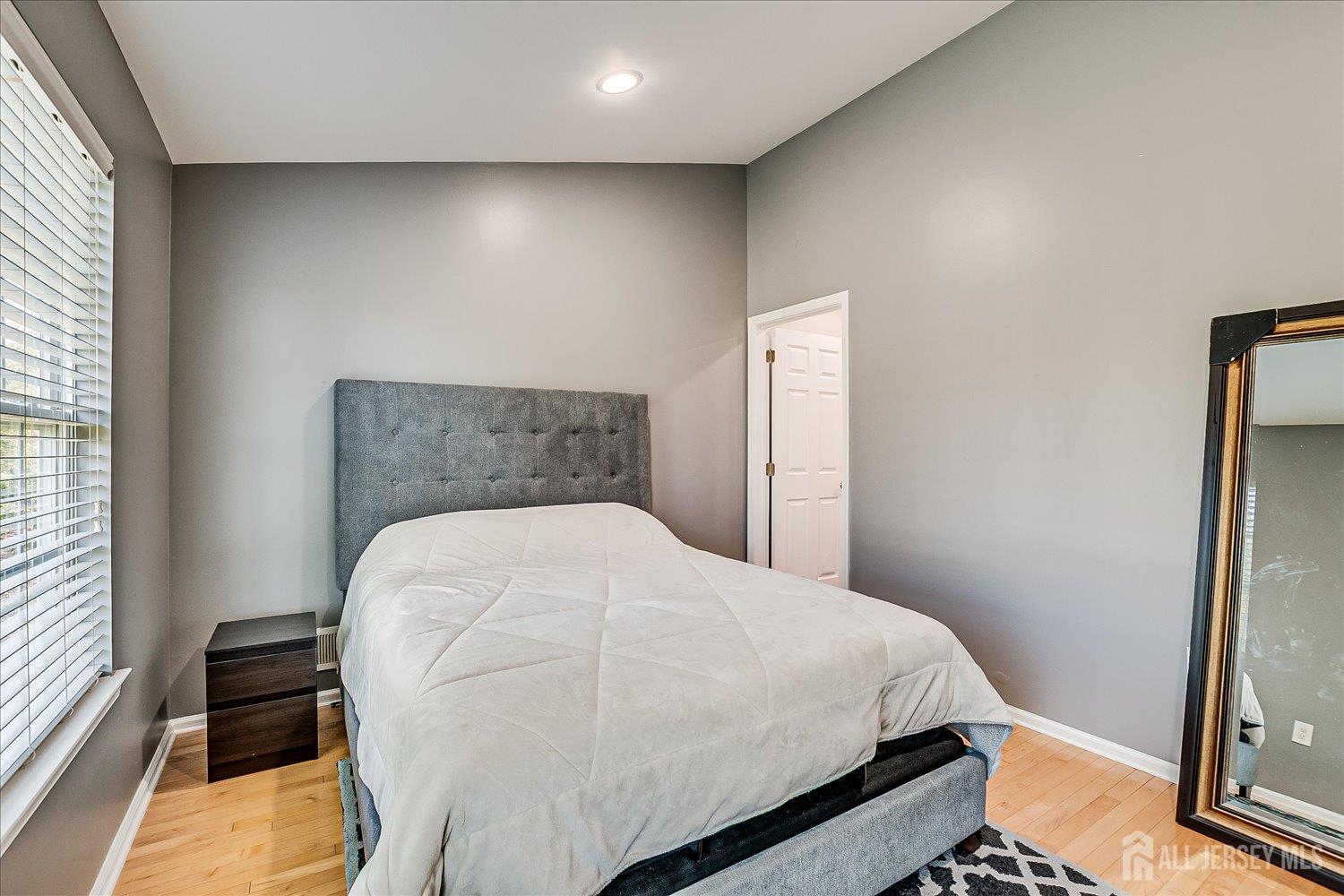 39 Rojewski Way Sayreville, NJ 08859 - Photo 25 of 40 a bed sitting in a bedroom next to a window