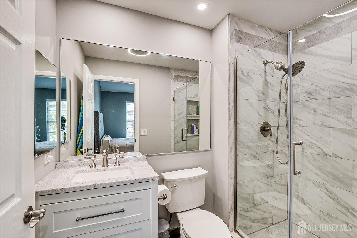 39 Rojewski Way Sayreville, NJ 08859 - Photo 26 of 40 a bathroom with a sink toilet and shower