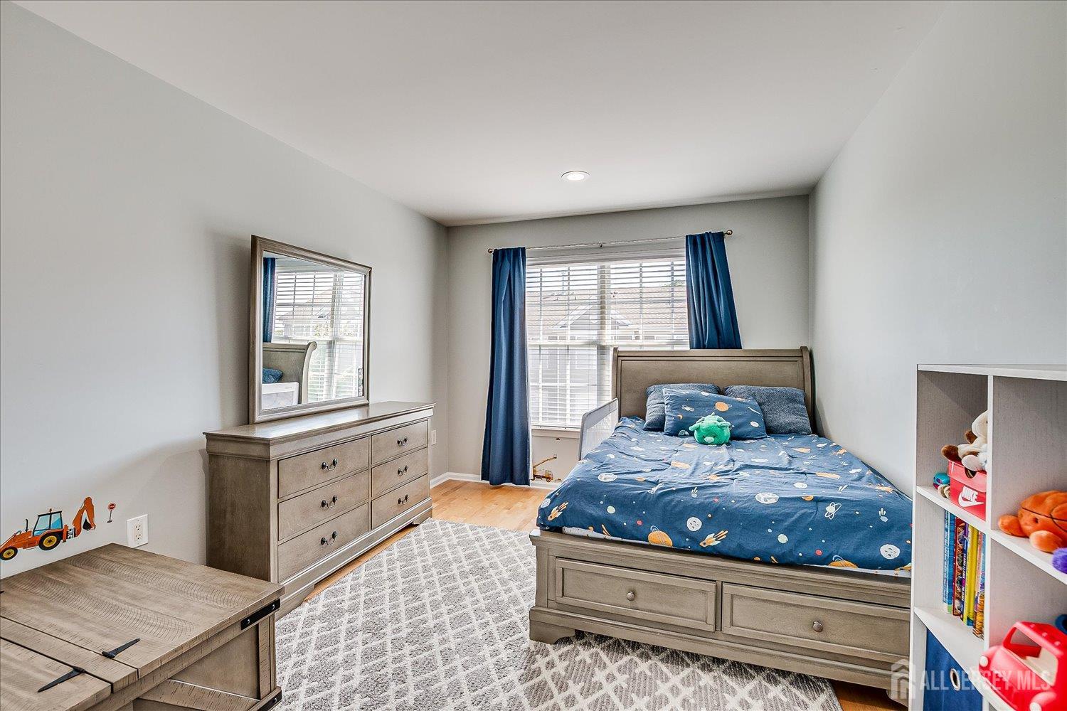 39 Rojewski Way Sayreville, NJ 08859 - Photo 27 of 40 a bedroom with a bed and window