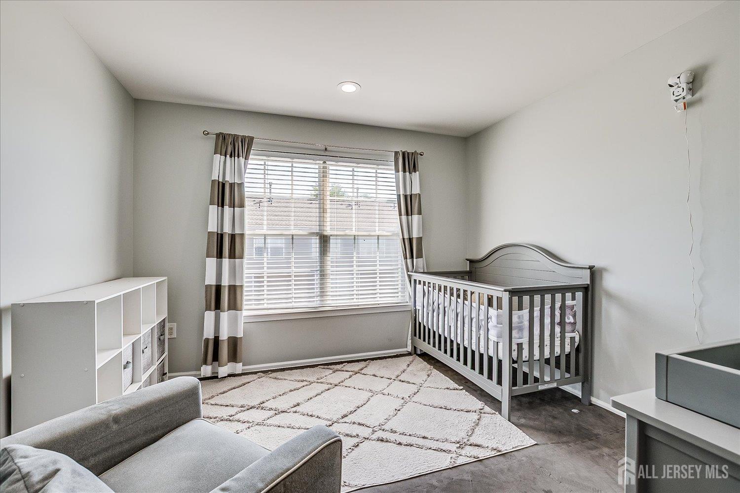 39 Rojewski Way Sayreville, NJ 08859 - Photo 29 of 40 a bedroom with furniture and a window