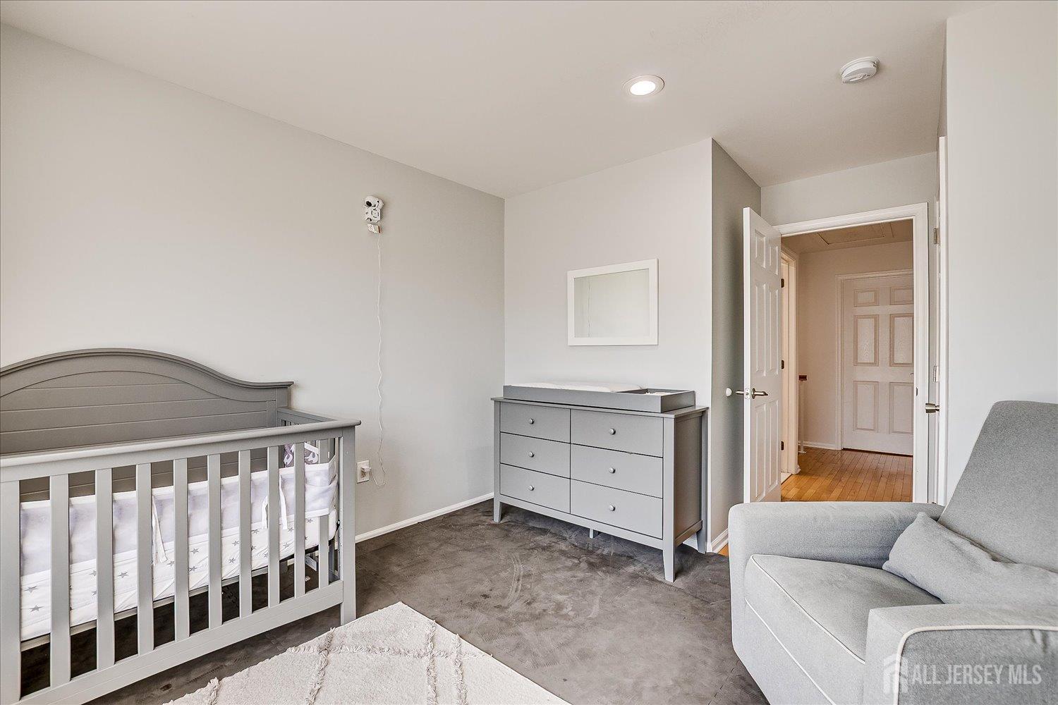 39 Rojewski Way Sayreville, NJ 08859 - Photo 30 of 40 a bedroom with furniture and a window