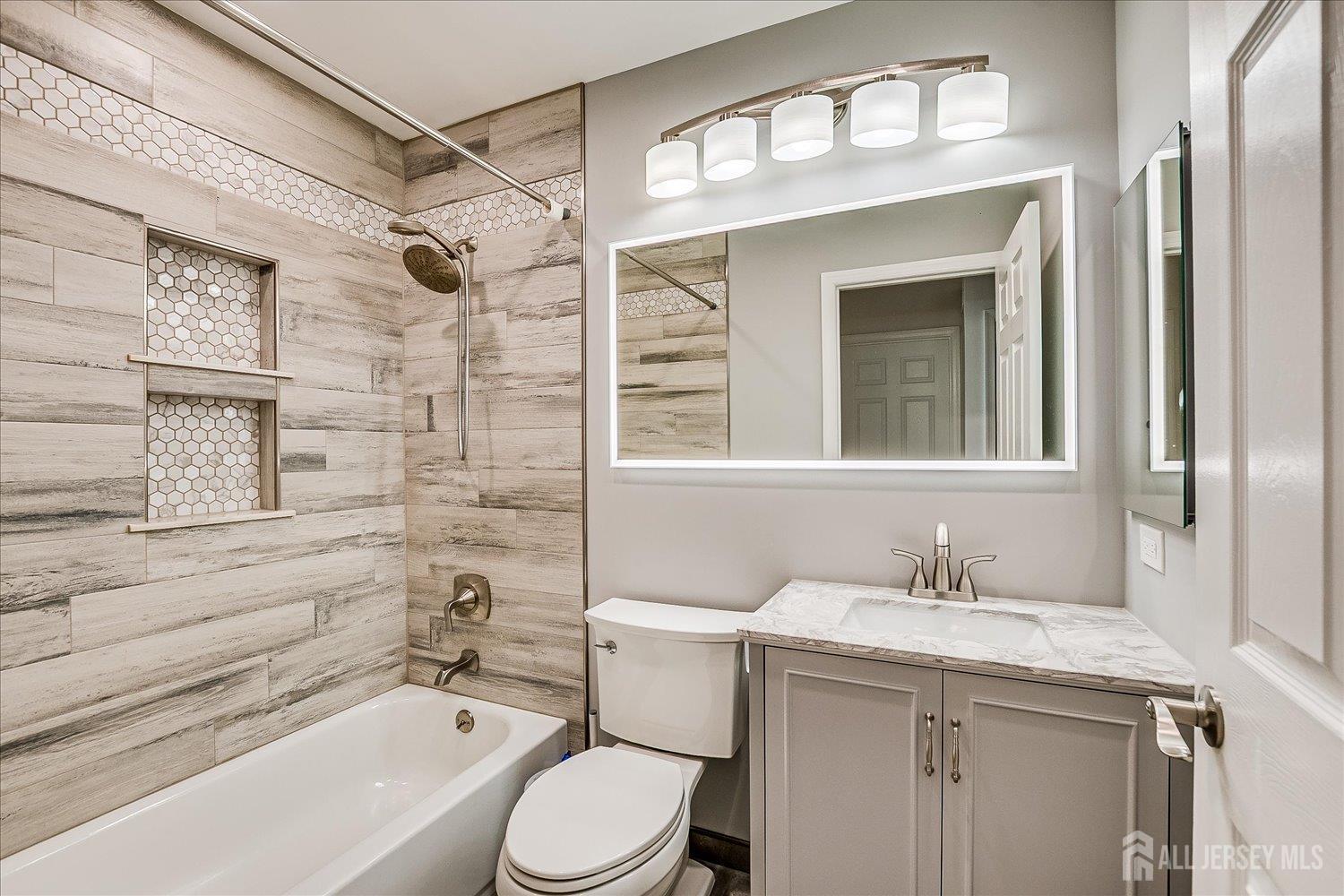39 Rojewski Way Sayreville, NJ 08859 - Photo 31 of 40 a bathroom with a sink a toilet and shower
