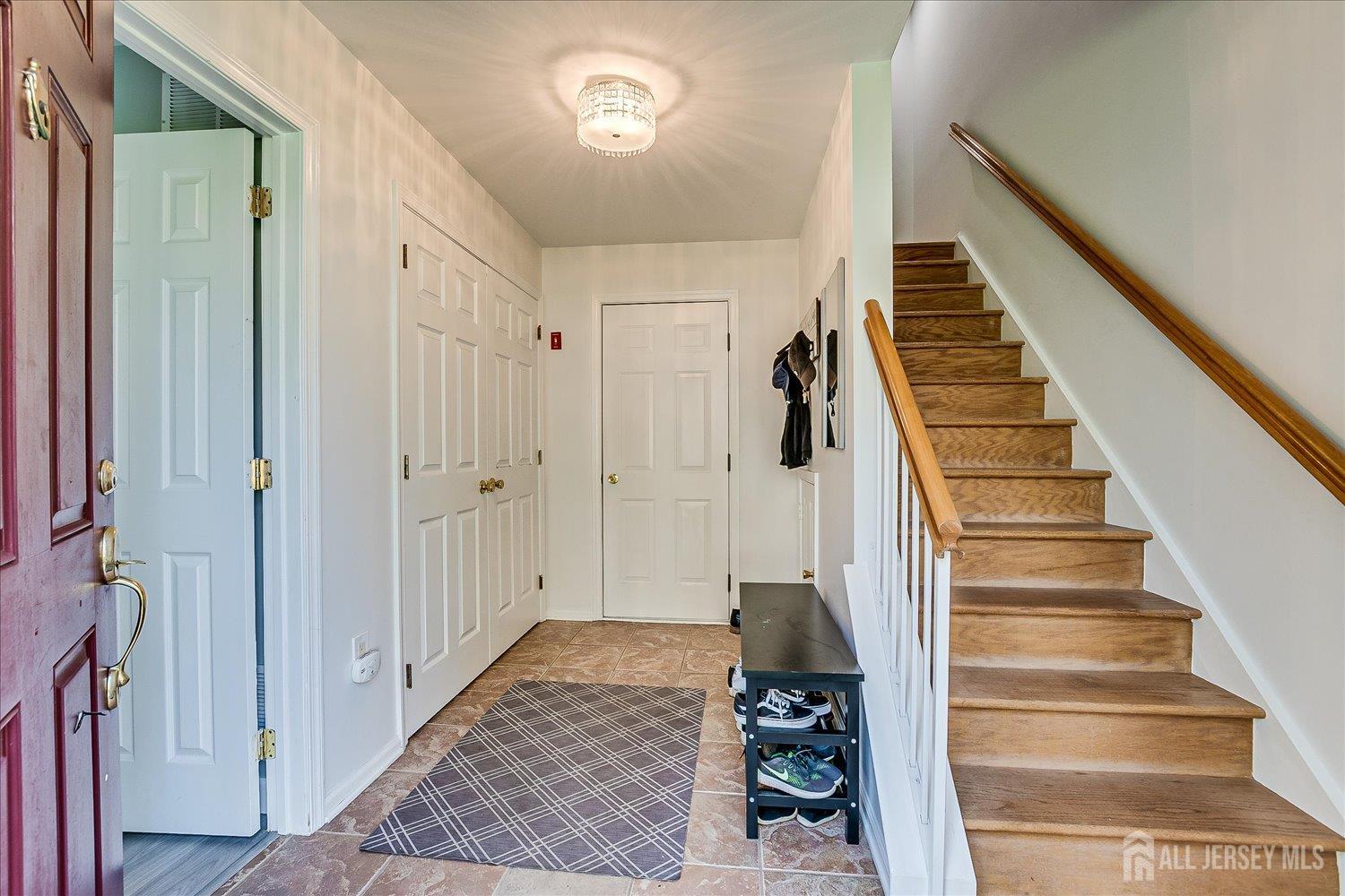 39 Rojewski Way Sayreville, NJ 08859 - Photo 6 of 40 a view of a hallway with wooden floor and entryway