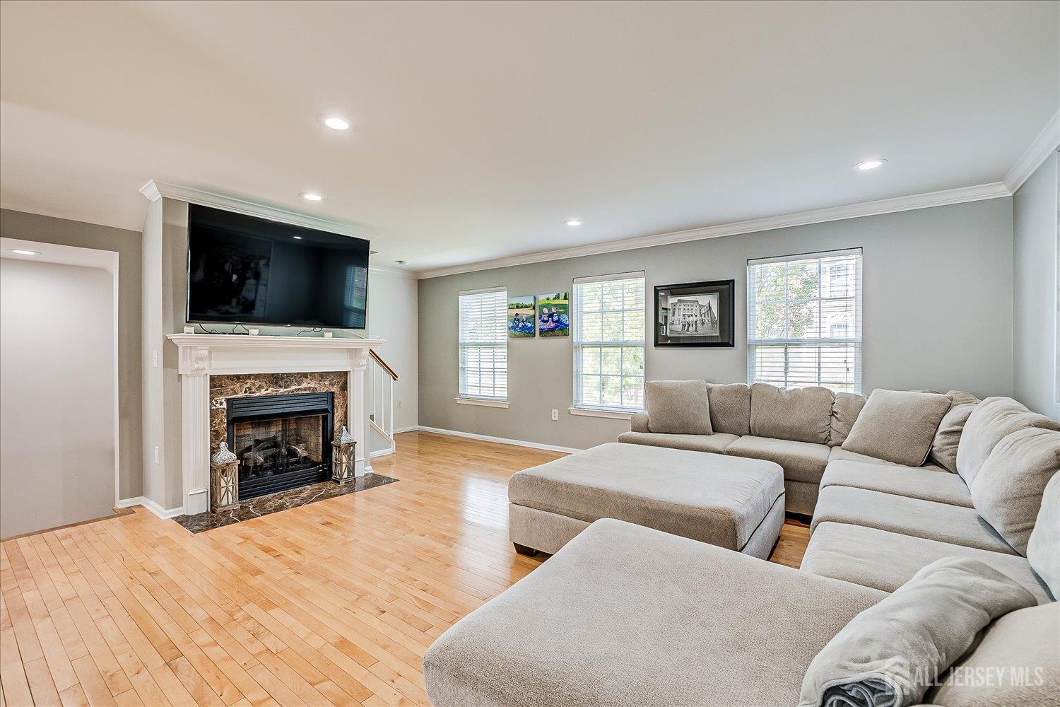 39 Rojewski Way Sayreville, NJ 08859 - Photo 9 of 40 a living room with fireplace furniture and a flat screen tv