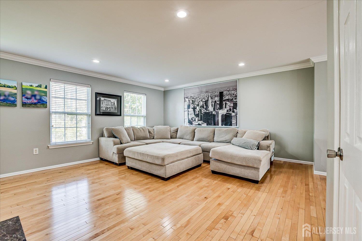 39 Rojewski Way Sayreville, NJ 08859 - Photo 10 of 40 a living room with furniture and a wooden floor