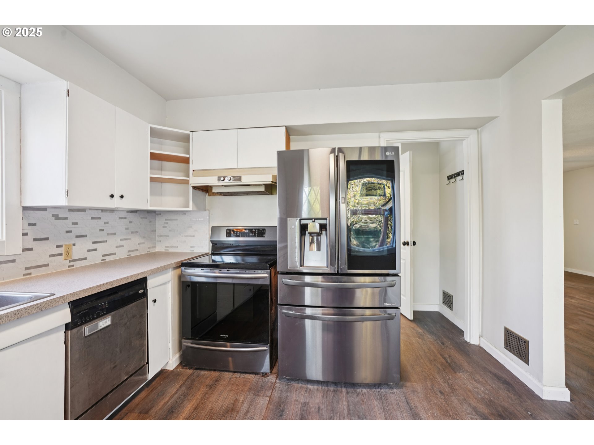 1315 North Russet Street Portland, OR 97217 - Photo 11 of 23 a kitchen with kitchen island a counter top space stainless steel appliances and cabinets