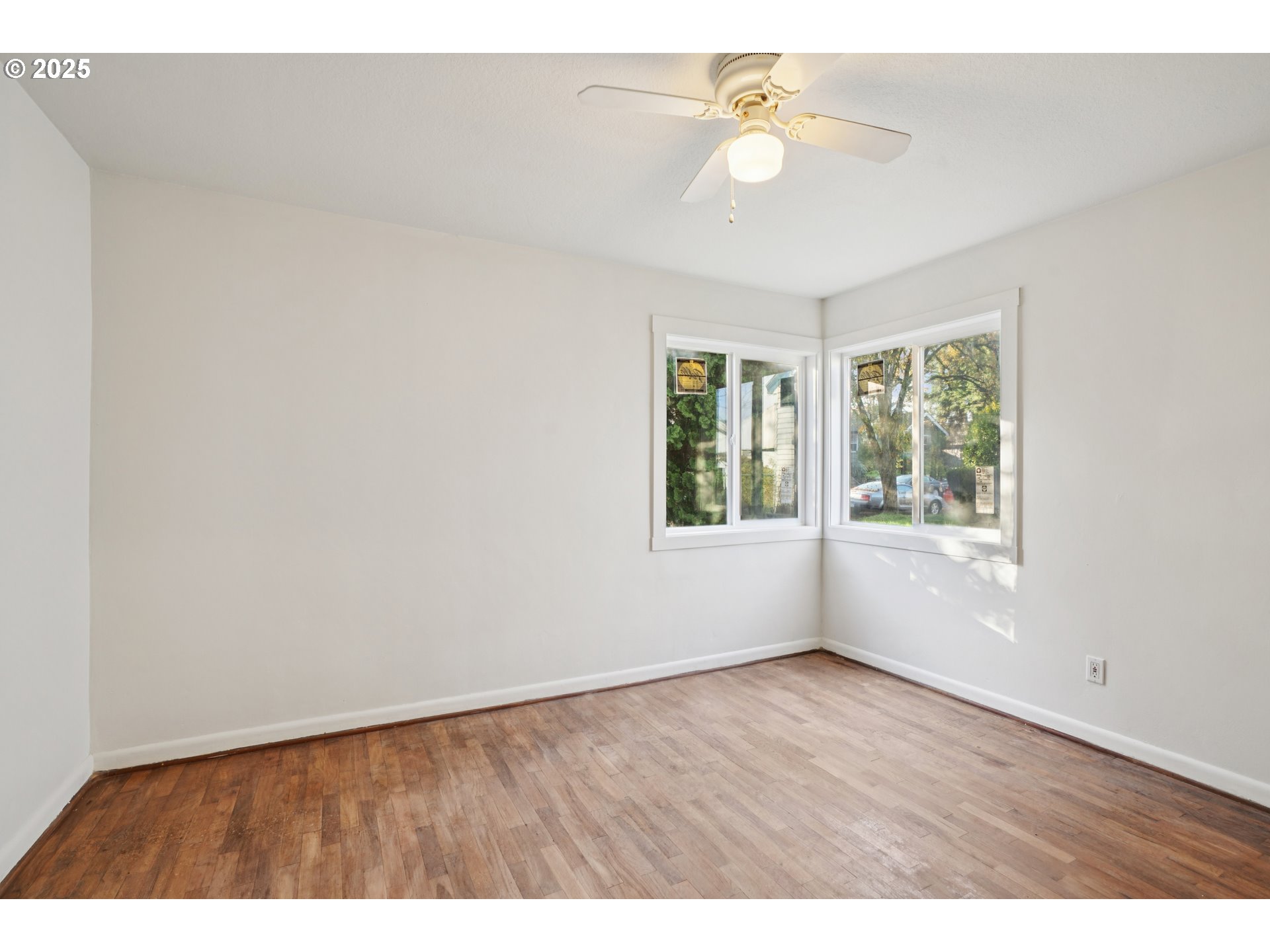 1315 North Russet Street Portland, OR 97217 - Photo 13 of 23 a view of an empty room with a window and a ceiling fan
