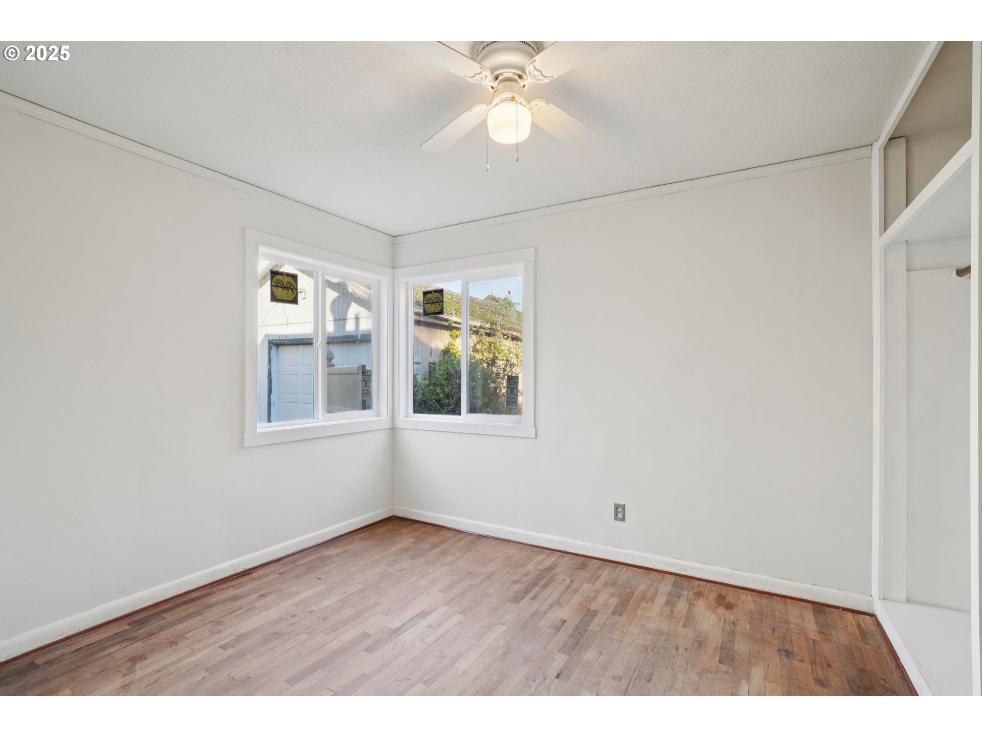 1315 North Russet Street Portland, OR 97217 - Photo 15 of 23 a view of an empty room with a window and a ceiling fan