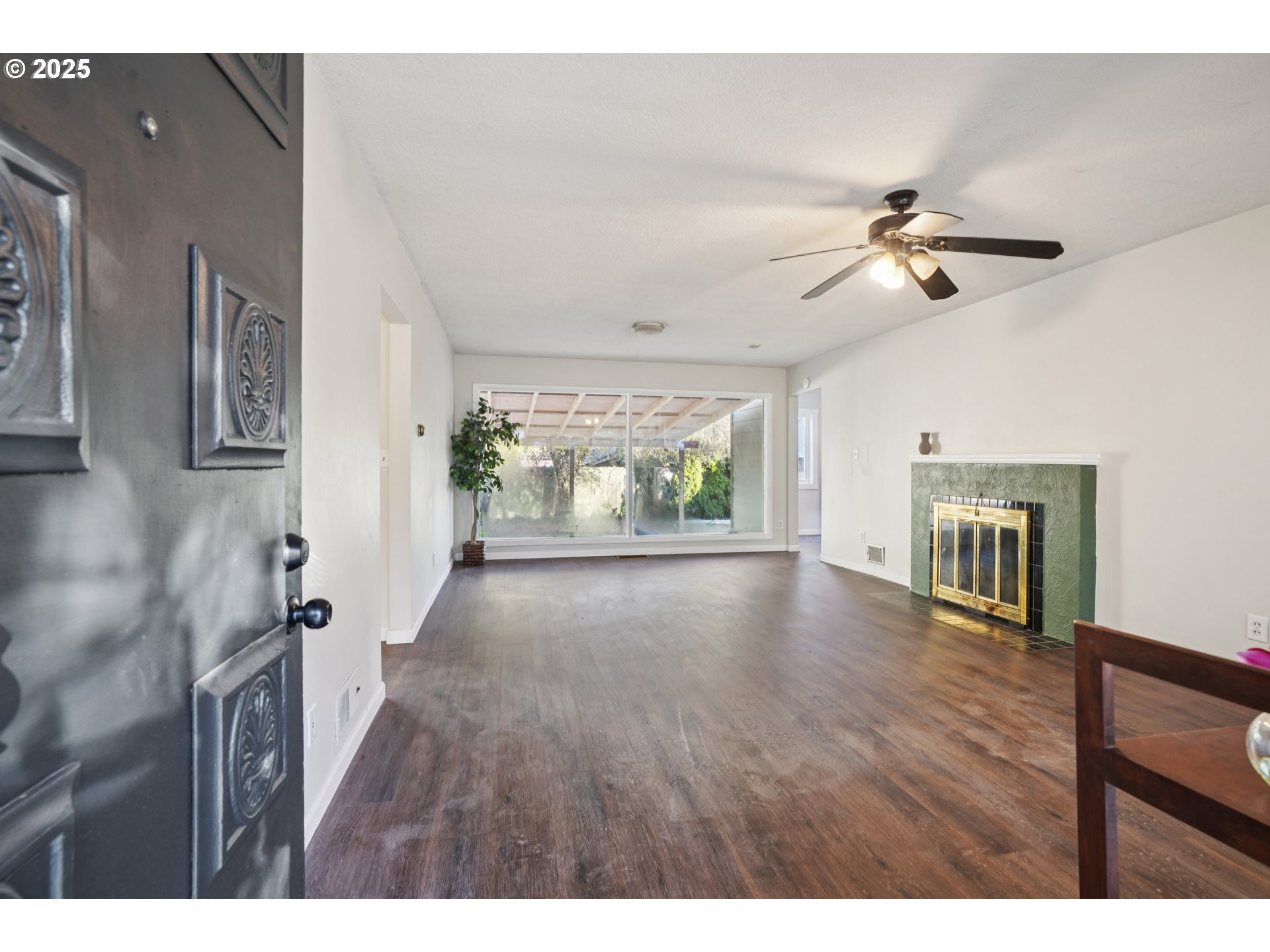 1315 North Russet Street Portland, OR 97217 - Photo 3 of 23 a view interior of a house wooden floor ceiling fan and windows