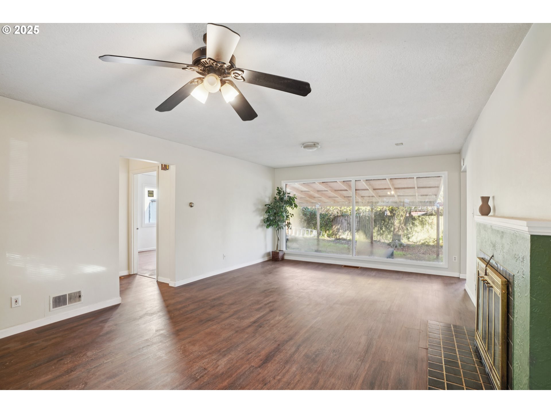 1315 North Russet Street Portland, OR 97217 - Photo 8 of 23 a view of an empty room with wooden floor and a window