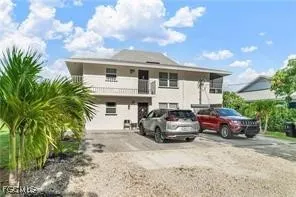 a front view of a house with parking