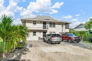 a front view of a house with parking