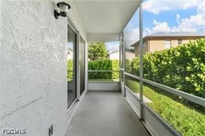 16001 Buccaneer Street, Unit 3 Bokeelia, FL 33922 - Photo 13 of 14 a view of balcony with yard