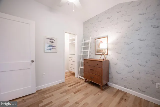 a room with a dresser and a wooden floor