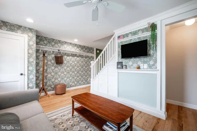 a living room with furniture and a flat screen tv