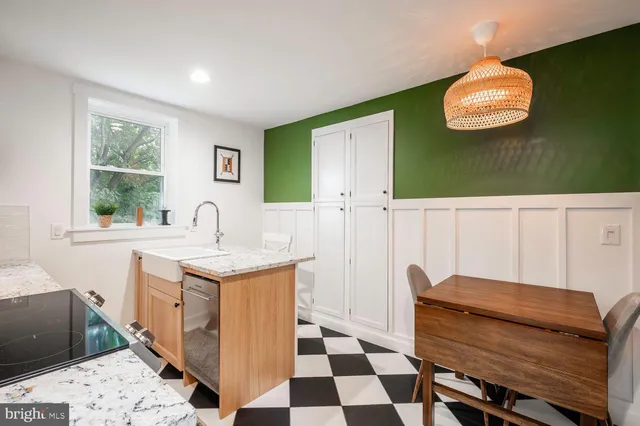 a kitchen with a sink and a stove top oven