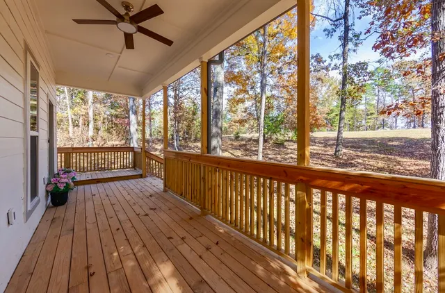 a view of a porch with wooden floor and outdoor space