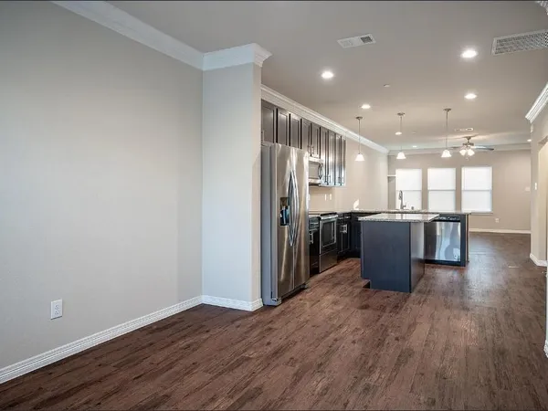 a view of kitchen with wooden floor