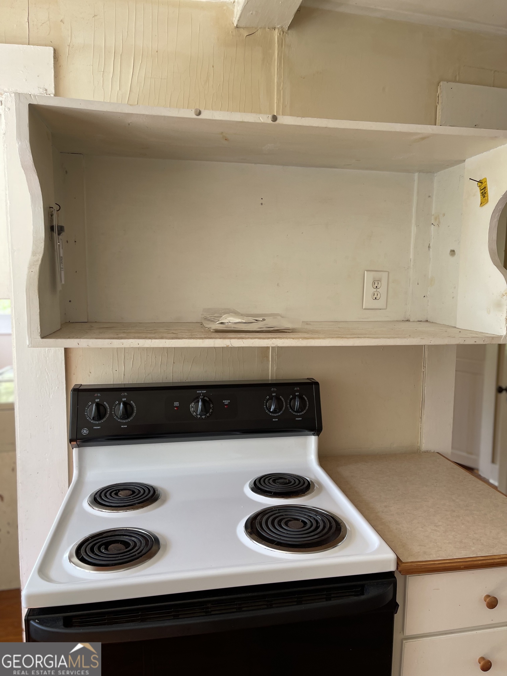 6505 23rd Avenue Valley, AL 36854 - Photo 11 of 49 a kitchen with a stove and cabinets