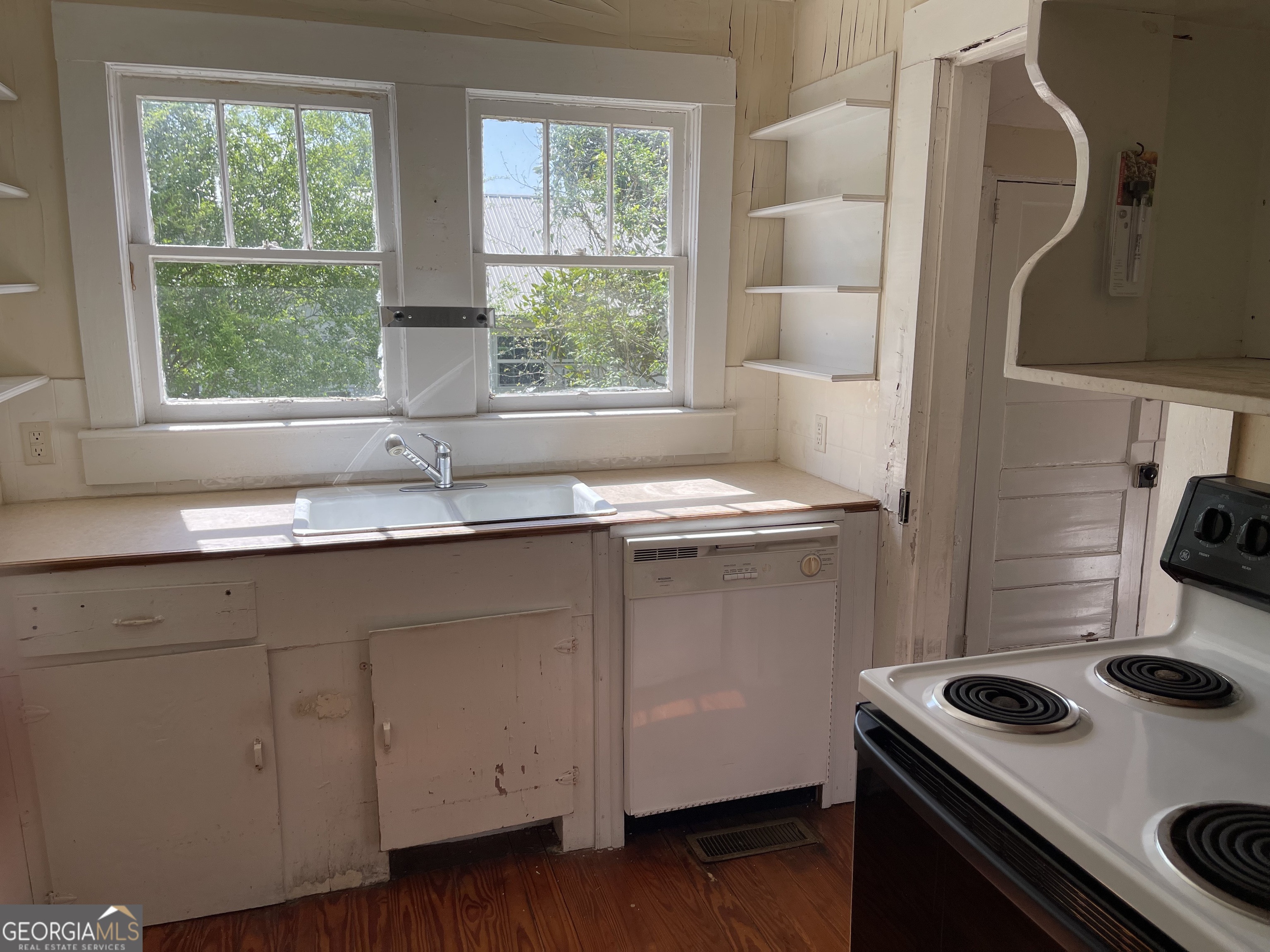 6505 23rd Avenue Valley, AL 36854 - Photo 21 of 49 a kitchen with a sink stove and cabinets