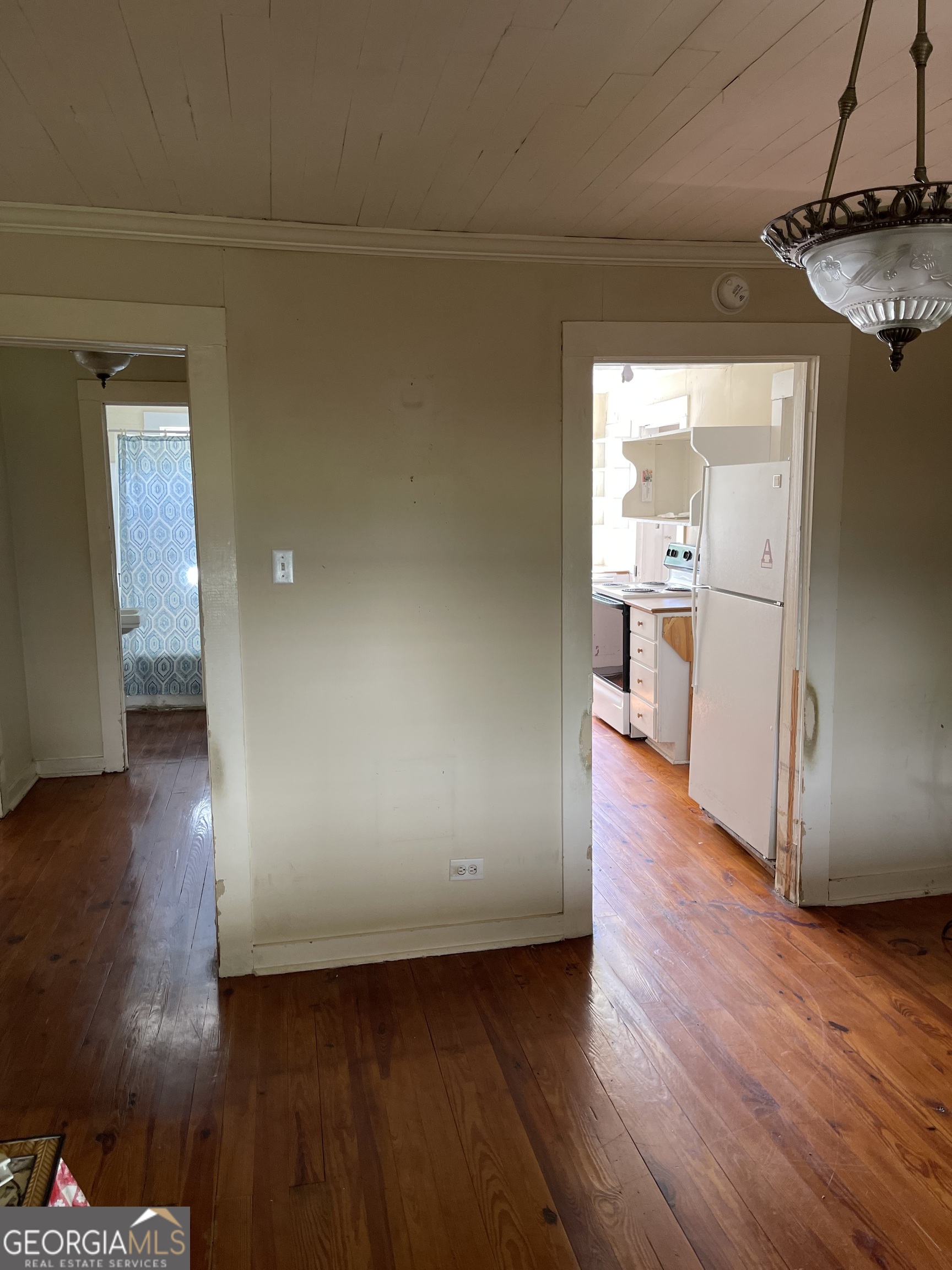 6505 23rd Avenue Valley, AL 36854 - Photo 22 of 49 a view of a refrigerator in kitchen and wooden floor