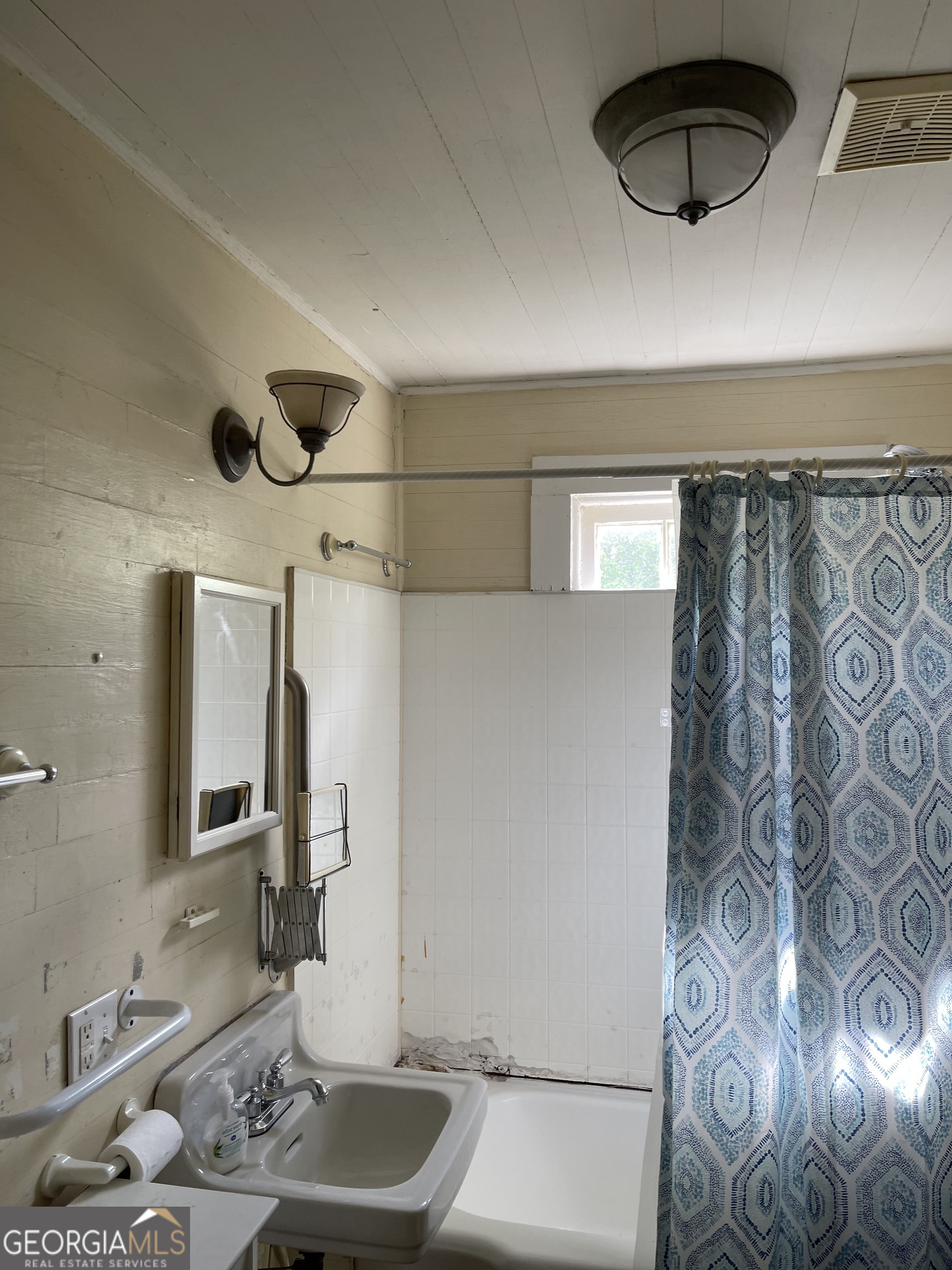 6505 23rd Avenue Valley, AL 36854 - Photo 30 of 49 a bathroom with a granite countertop sink a toilet and mirror