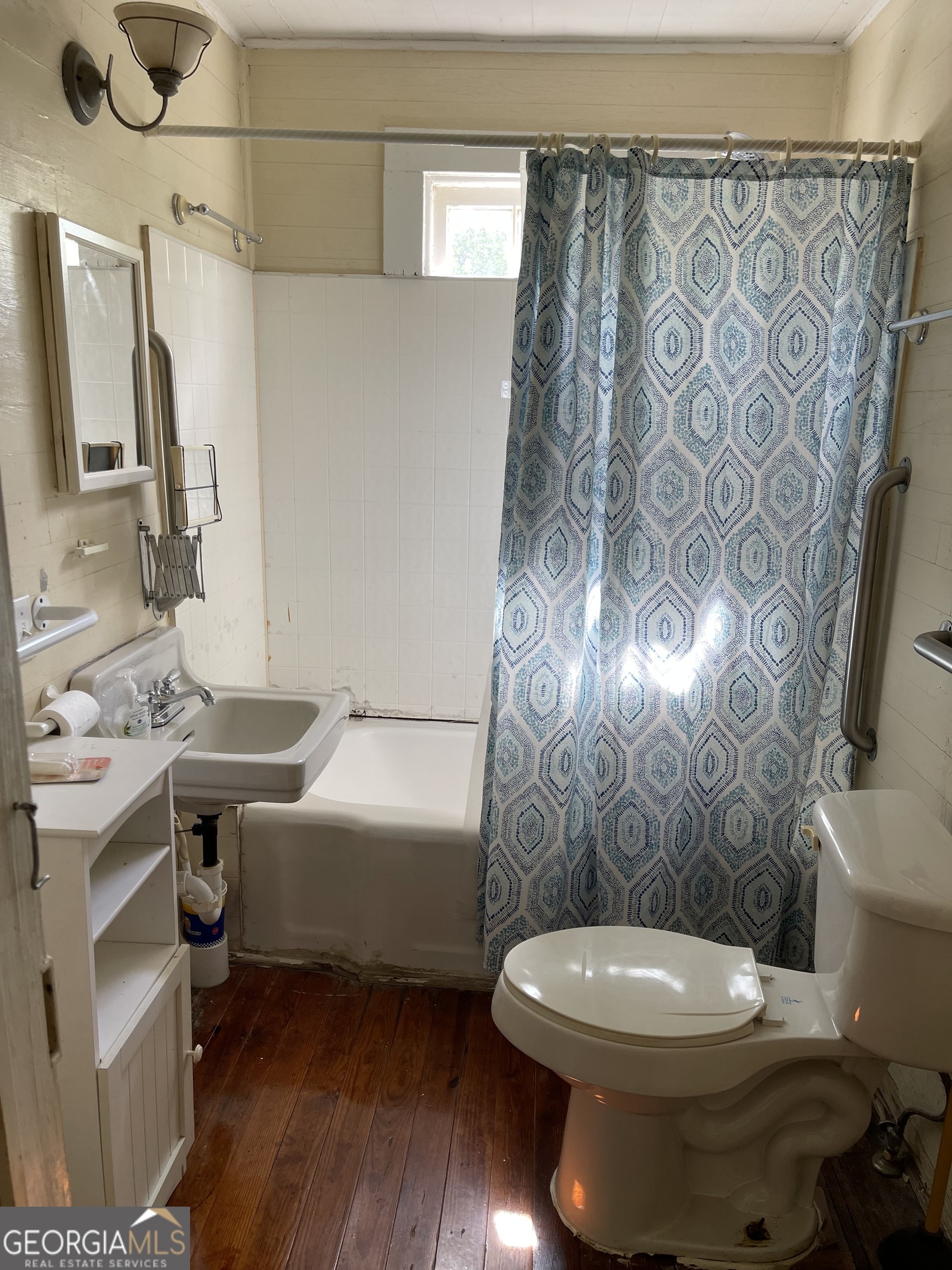 6505 23rd Avenue Valley, AL 36854 - Photo 31 of 49 a bathroom with a toilet sink and mirror