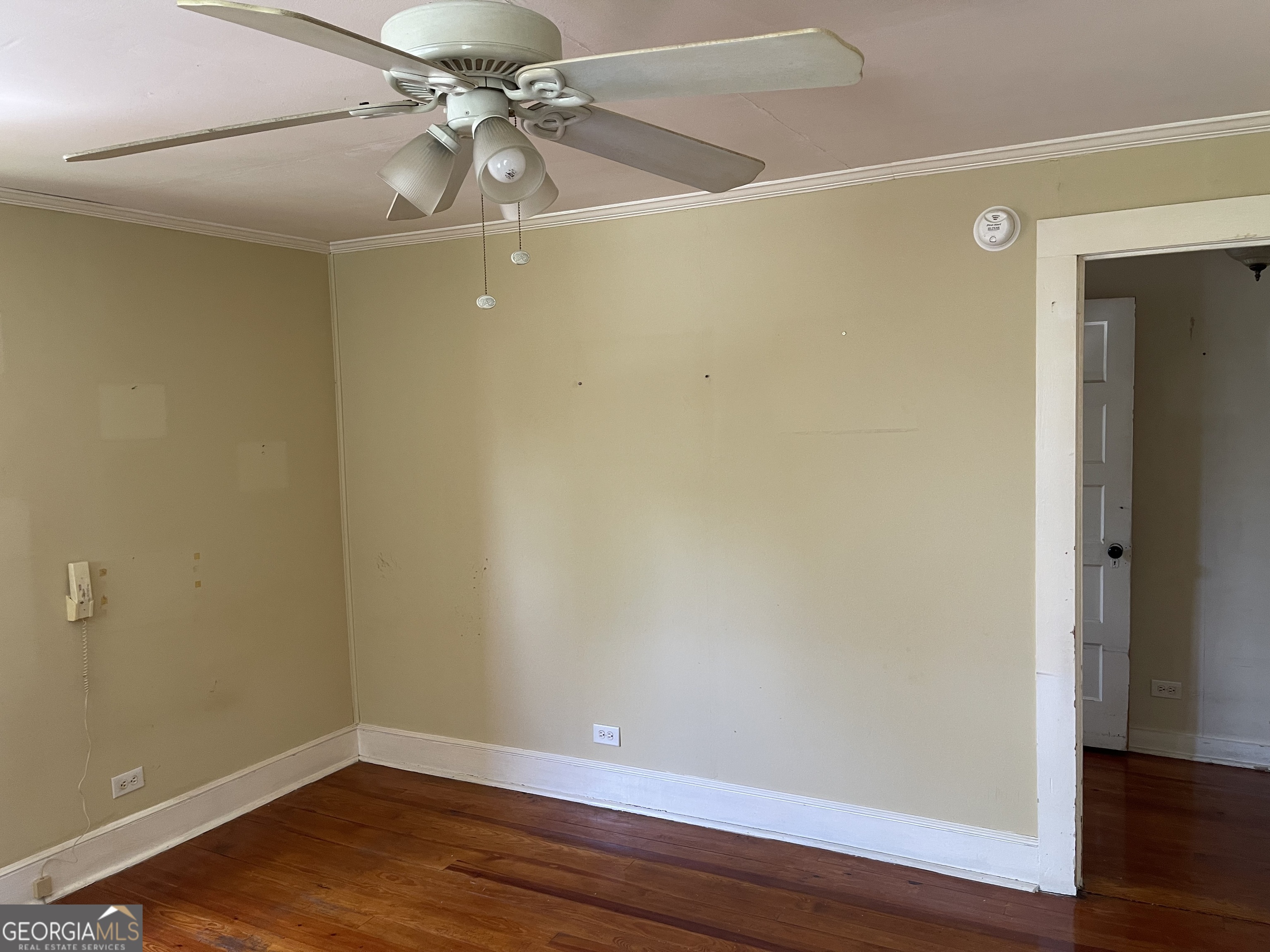 6505 23rd Avenue Valley, AL 36854 - Photo 34 of 49 a view of a small space with wooden floor and a ceiling fan