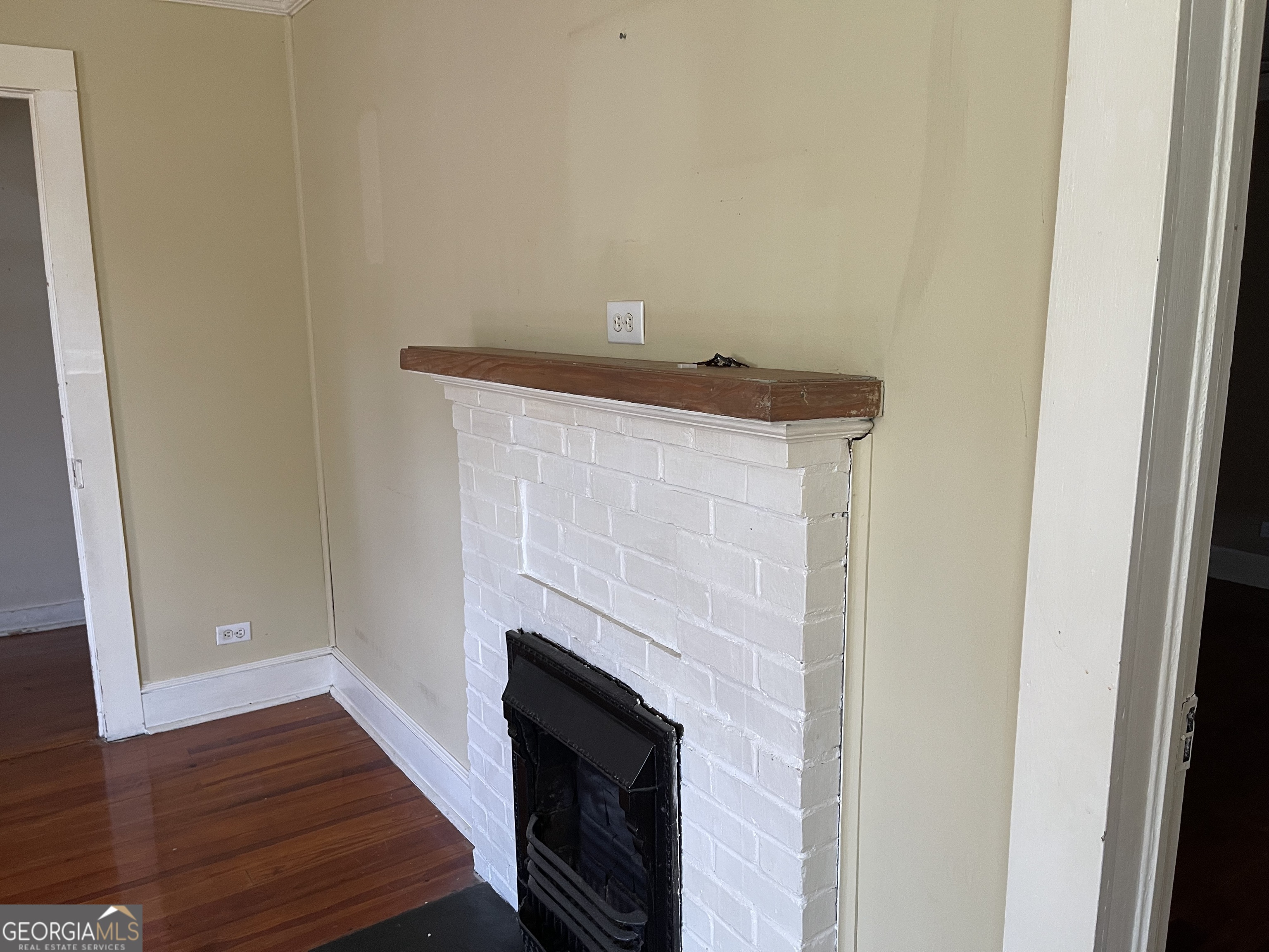 6505 23rd Avenue Valley, AL 36854 - Photo 35 of 49 a view of a livingroom with wooden floor and a fireplace