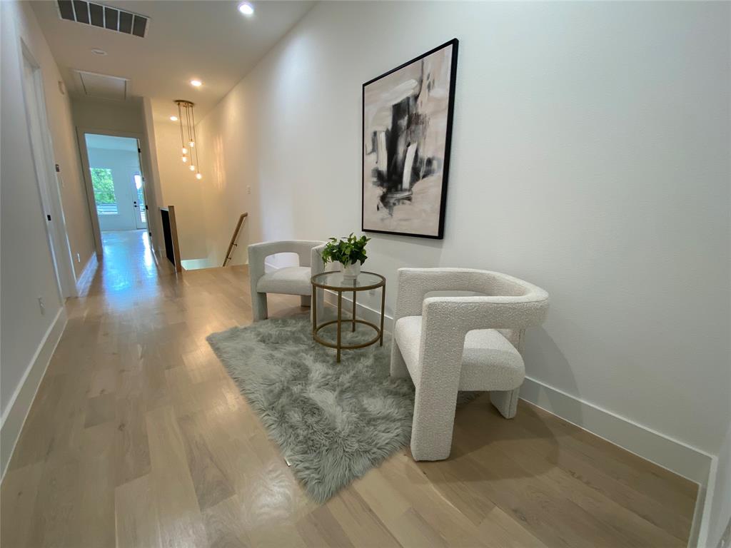 807 South Glasgow Drive Dallas, TX 75223 - Photo 11 of 25 a living room with furniture and a wooden floor