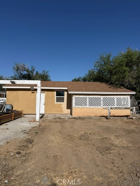 16100 Navajo Road Apple Valley, CA 92307 - Photo 2 of 55 a view of a house with a backyard and a mountain