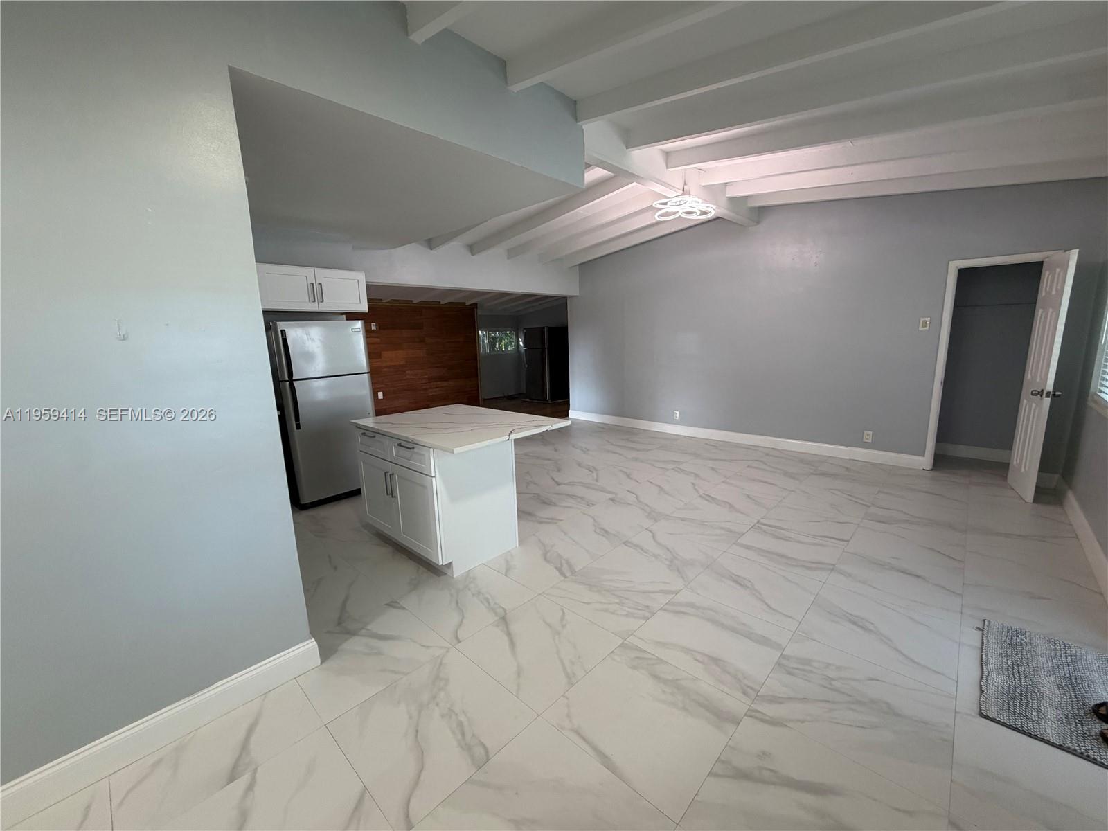 4210 Southwest 10th Street Plantation, FL 33317 - Photo 4 of 19 a view of a hallway with a kitchen