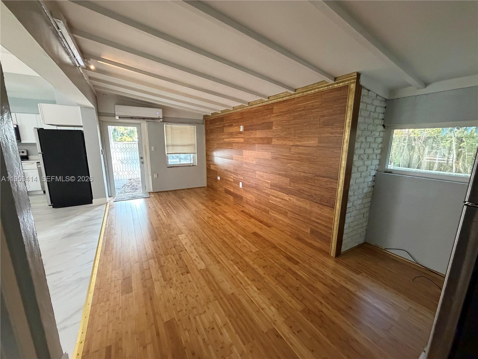 4210 Southwest 10th Street Plantation, FL 33317 - Photo 6 of 19 a view of a hallway with wooden floor and stairs