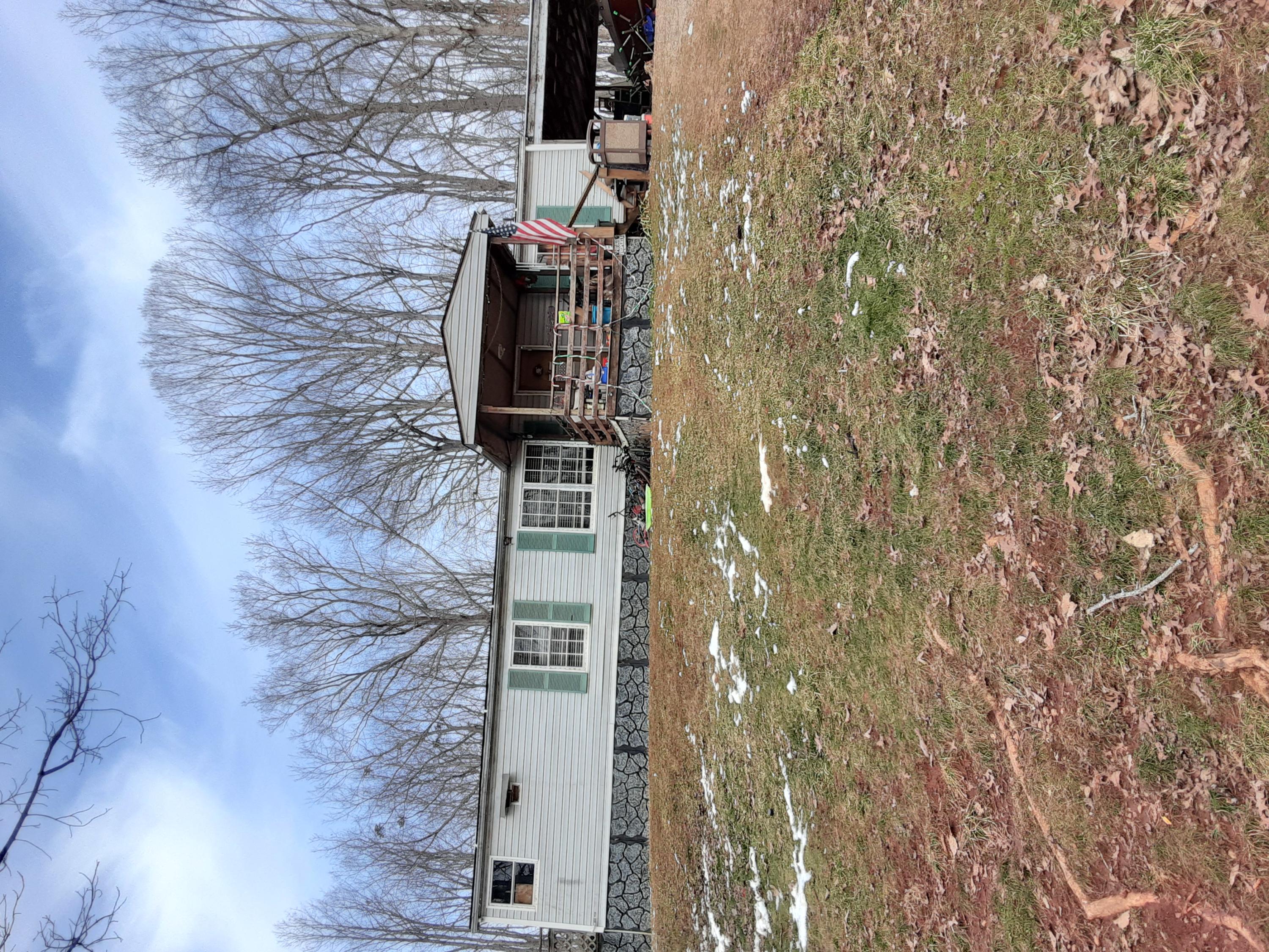 a view of a house with backyard