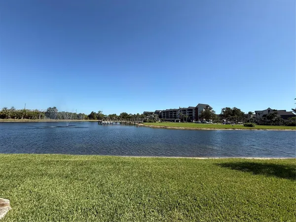 a view of lake and houses with outdoor space