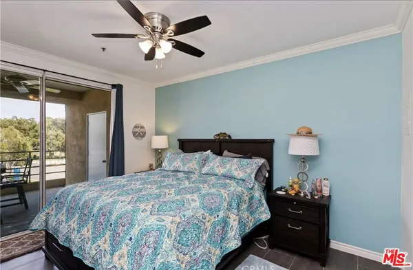 a bedroom with a bed and a lamp