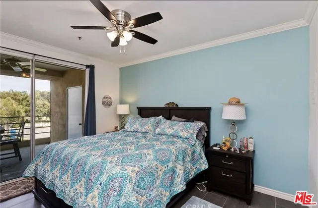 a bedroom with a bed and a lamp