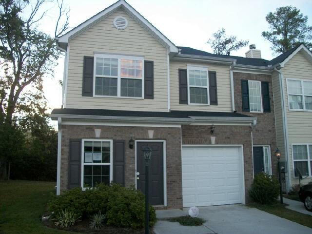 6462 Rockaway Road Atlanta, GA 30349 - Photo 1 of 1 a front view of a house with garden